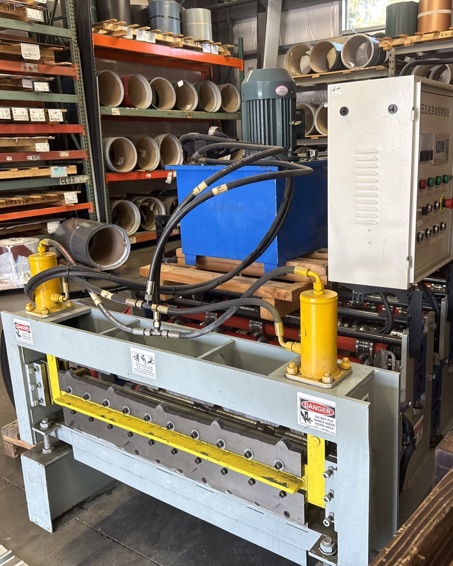 Caliber's in-shop roll-forming machine that runs PBR and Tuff-Rib panels