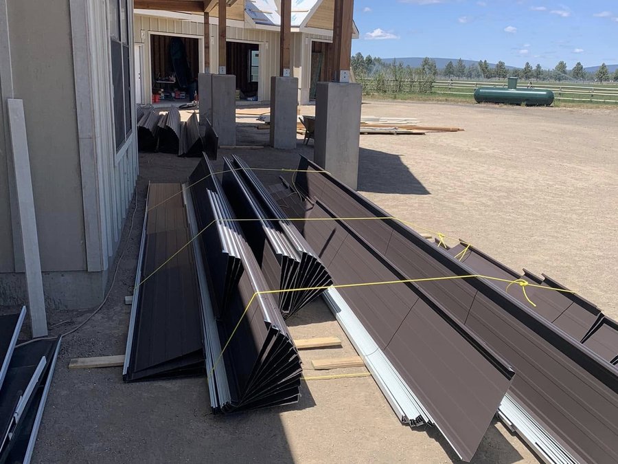Bronze panels staged outside a home under construction