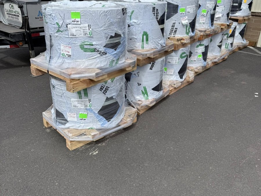 Wrapped pallets of coil stock outside the Caliber shop